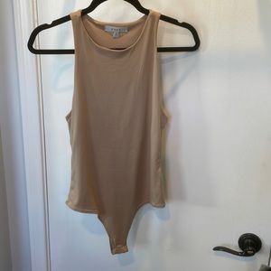 Tan cotton body suit never been worn size medium